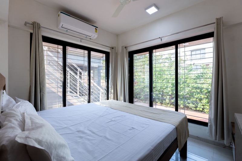 Bedroom with floor-to-ceiling windows